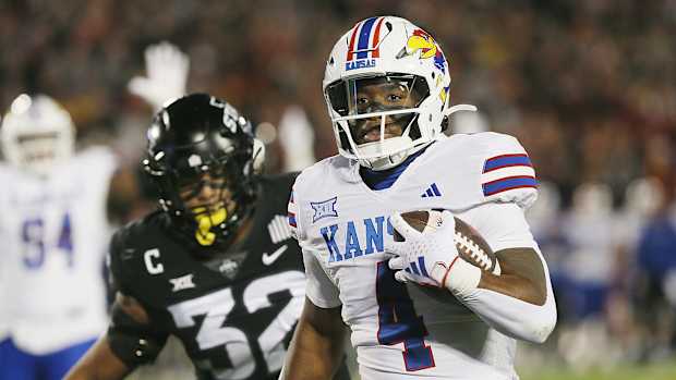 Kansas Jayhawks running back Devin Neal (4) runs for a touchdown against Iowa State during the first quarter at Jack Trice Stadium on Saturday, Nov. 4, 2023, in Ames, Iowa.  
